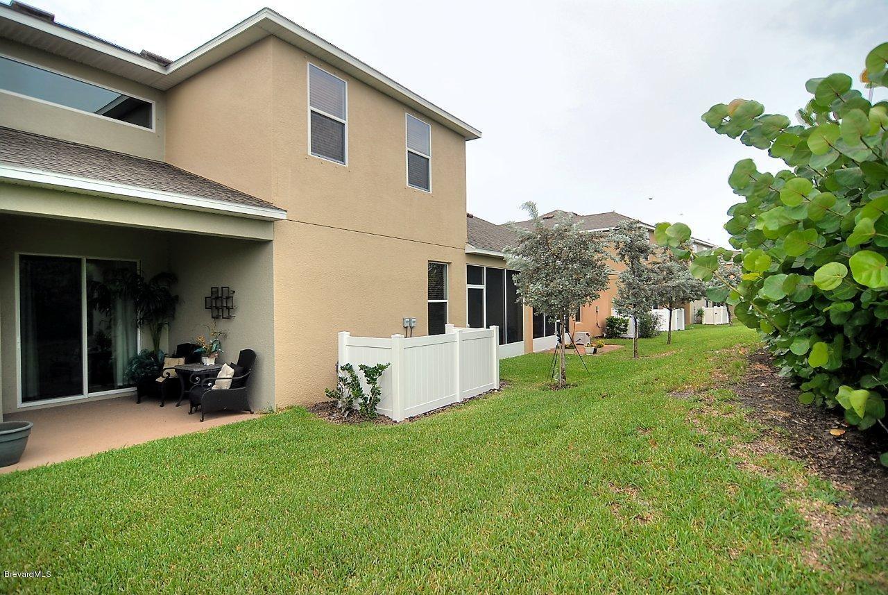620 Bismarck Way Indialantic, FL 32903 - Photo 14 of 14 a view of a house with backyard sitting area and garden