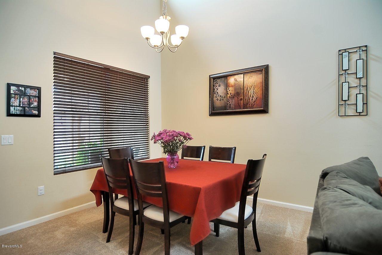 620 Bismarck Way Indialantic, FL 32903 - Photo 5 of 14 a dining room with furniture and window
