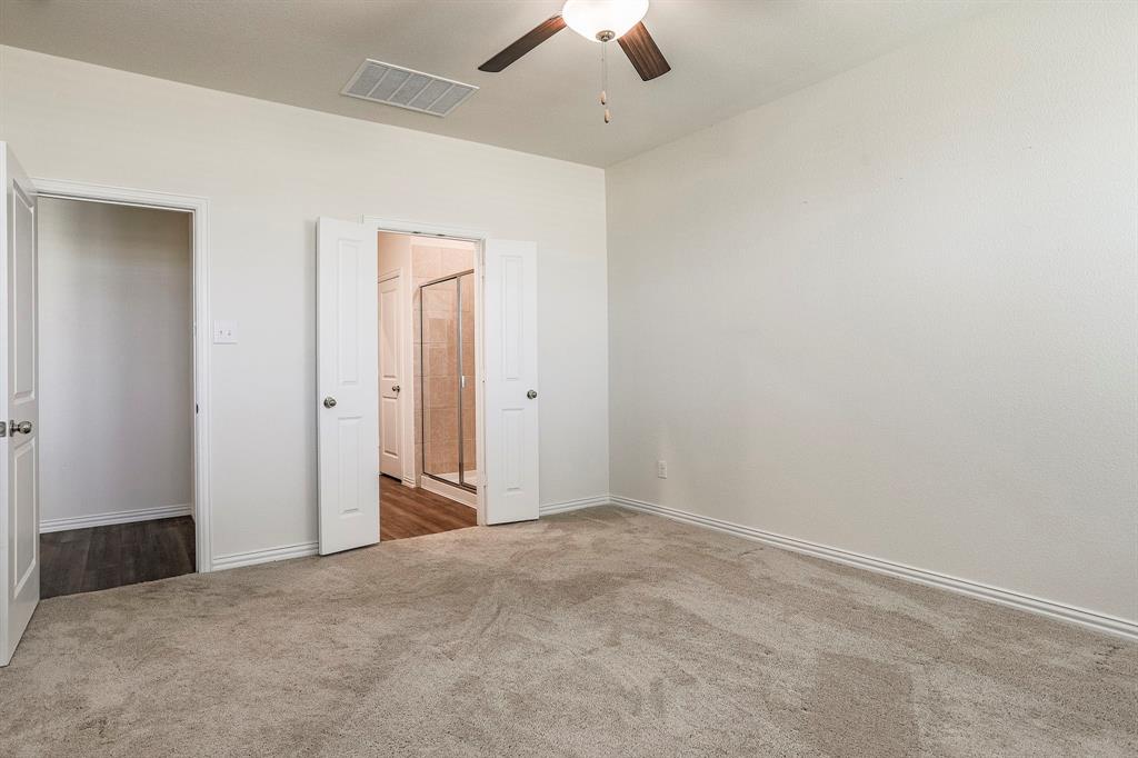 652 Ridgeback Trail Fort Worth, TX 76052 - Photo 14 of 20 Unfurnished bedroom with ceiling fan and carpet floors