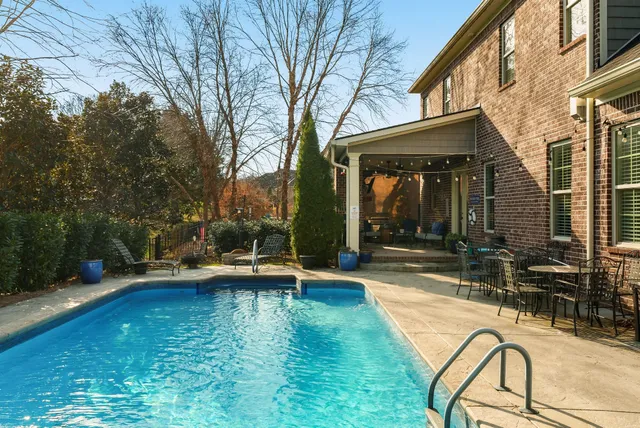 a view of a swimming pool with a lounge chairs