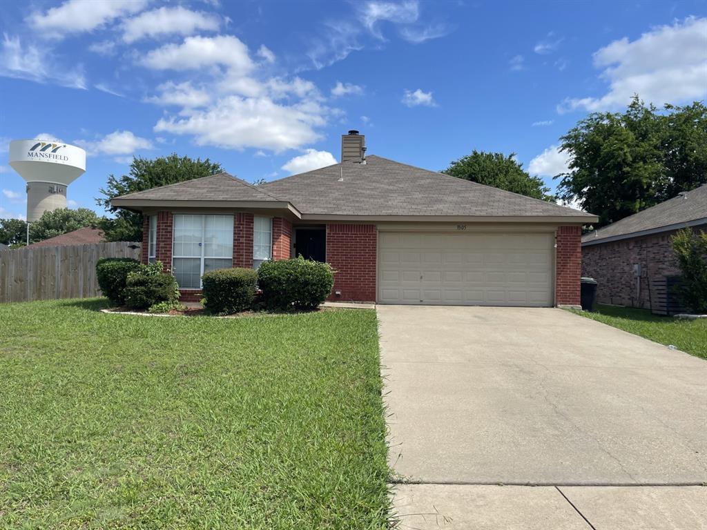 3305 Rustic Meadow Trail Mansfield, TX 76063 - Photo 1 of 12 Brick facade residence with an attached garage, featuring a concrete driveway and an established lawn