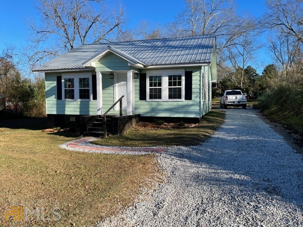 308 Trammell Avenue Valley, AL 36854 - Photo 1 of 1 a front view of a house with a yard