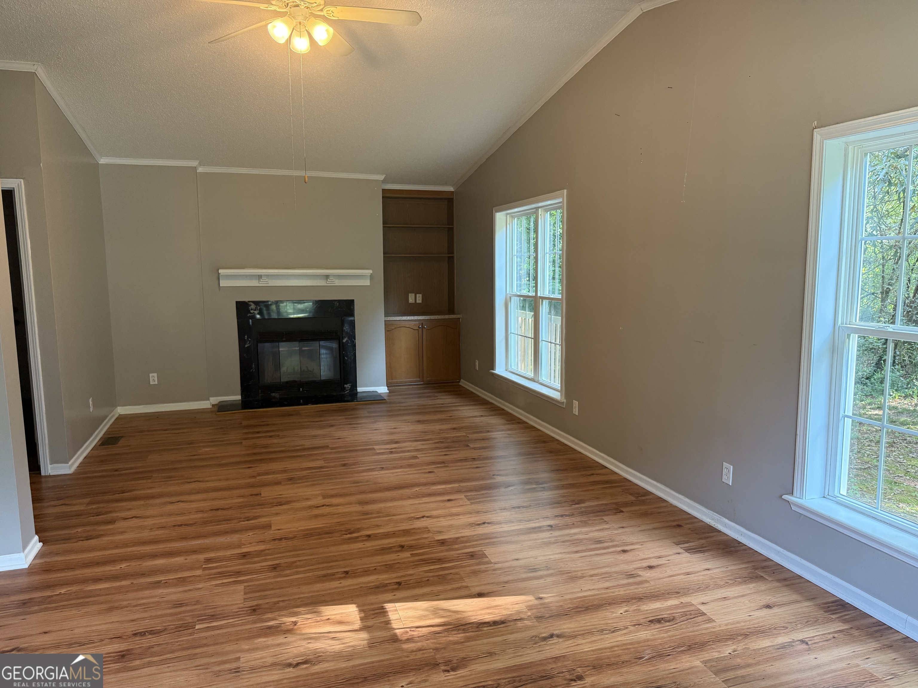 714 Yates Road Bowdon, GA 30108 - Photo 27 of 28 a view of an empty room with window and fire place