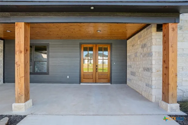 a front view of a house with a large window