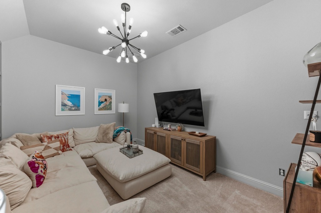 5425 Cherokee Draw Road Austin, TX 78738 - Photo 14 of 40 A comfortable living room presents ample space for relaxation and entertainment.