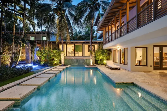 a swimming pool with patio outdoor seating and yard