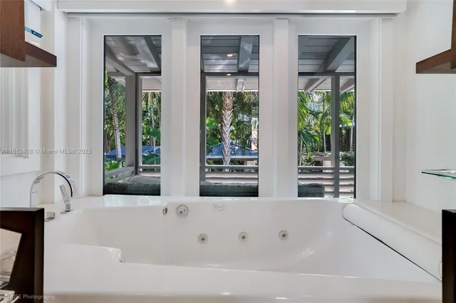 a living room with furniture a ceiling fan and a rug