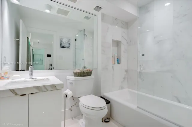 a view of a house with a big yard couches and wooden floor