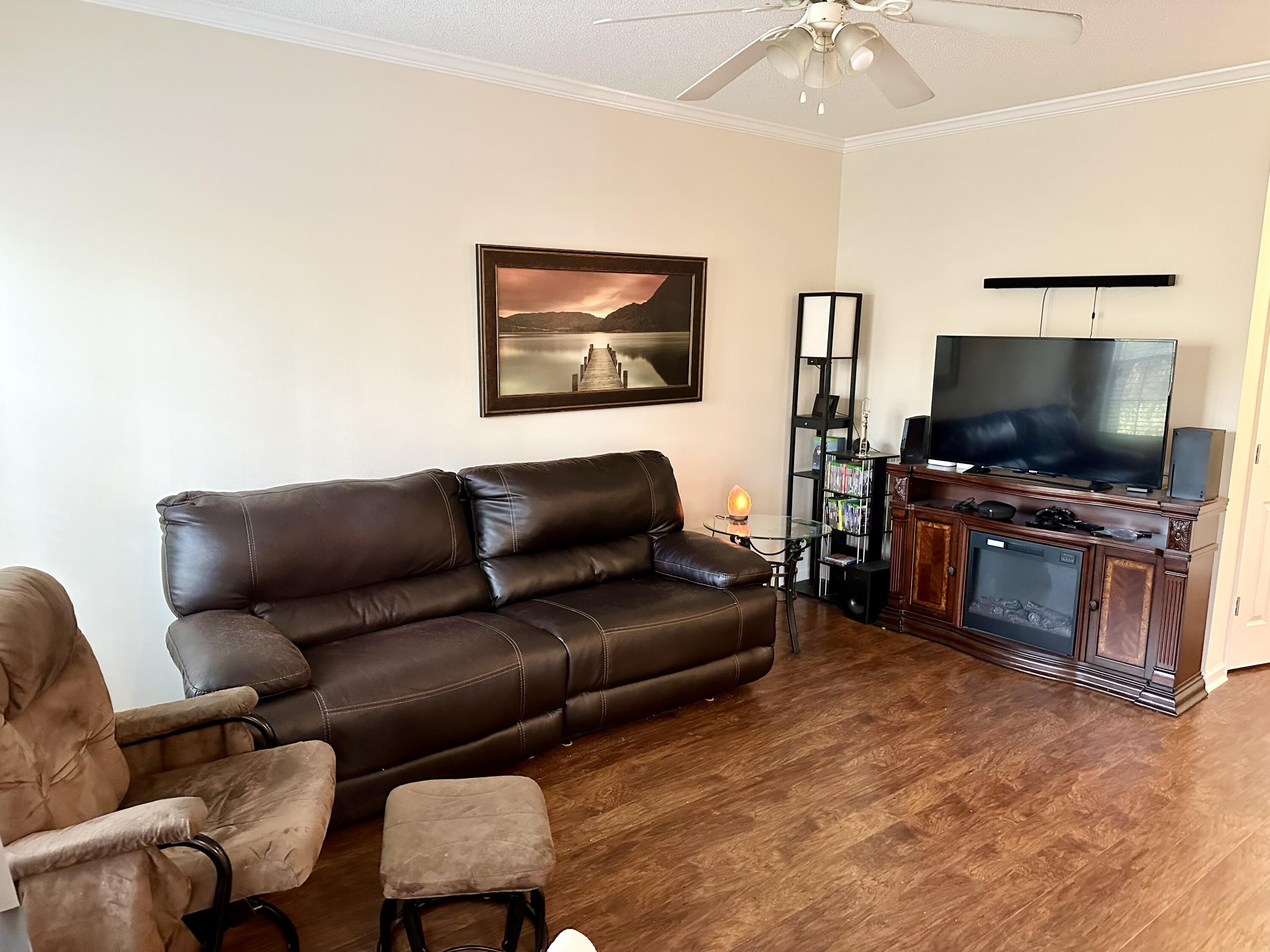 732 East Mack Bayou Drive, Unit 2 Santa Rosa Beach, FL 32459 - Photo 6 of 43 a living room with furniture and a flat screen tv
