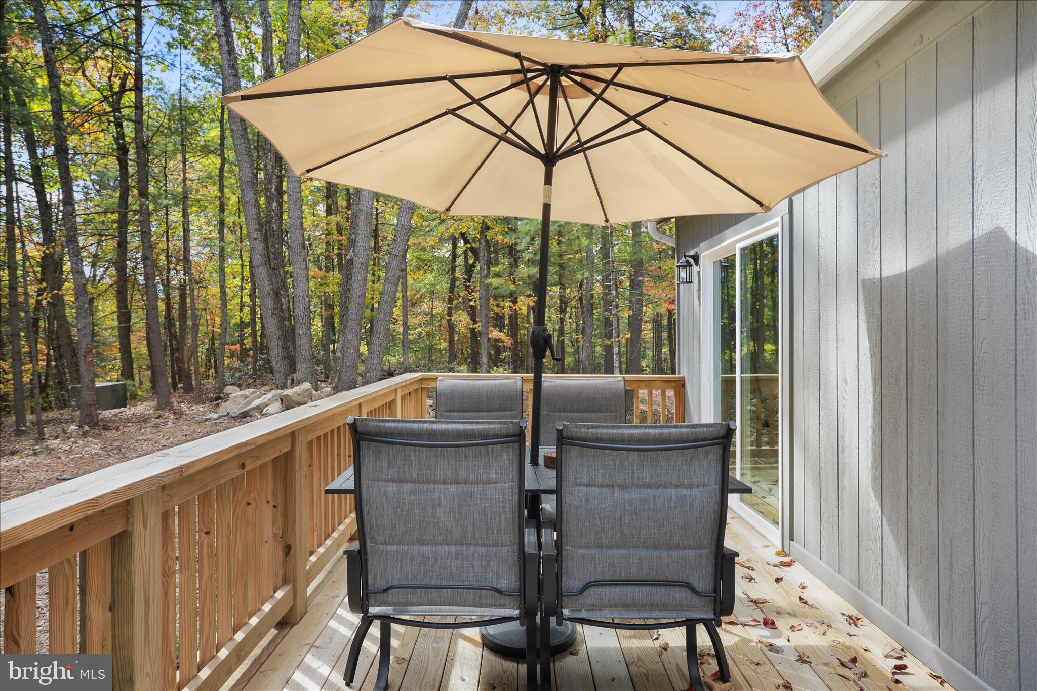 598 Crabapple Road Mount Jackson, VA 22842 - Photo 30 of 32 a view of balcony with a table and chairs under an umbrella