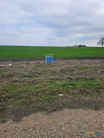 a view of a yard with an outdoor space