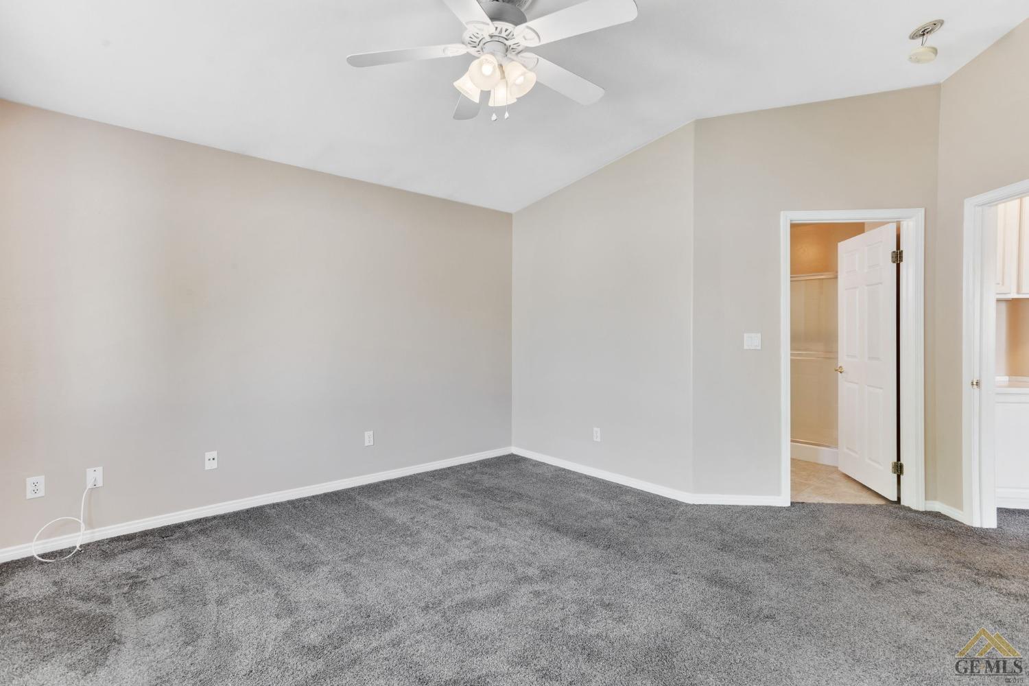 Undisclosed Address Bakersfield, CA 93311 - Photo 24 of 39 a view of an empty room with a ceiling fan