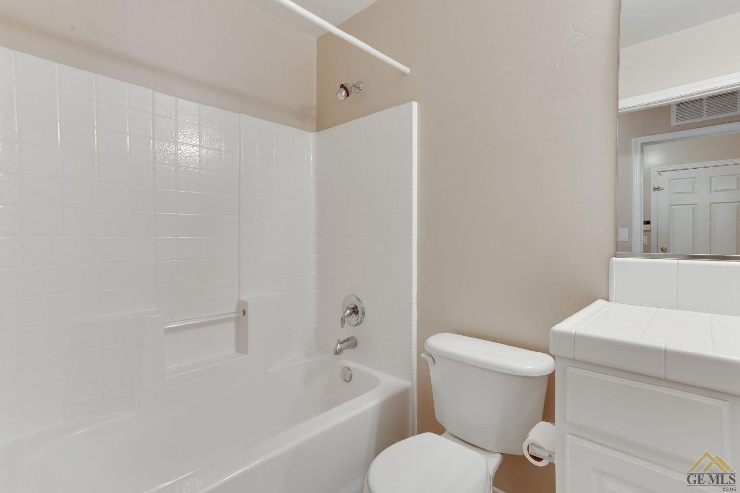 Undisclosed Address Bakersfield, CA 93311 - Photo 29 of 39 a white toilet sitting next to a bath tub