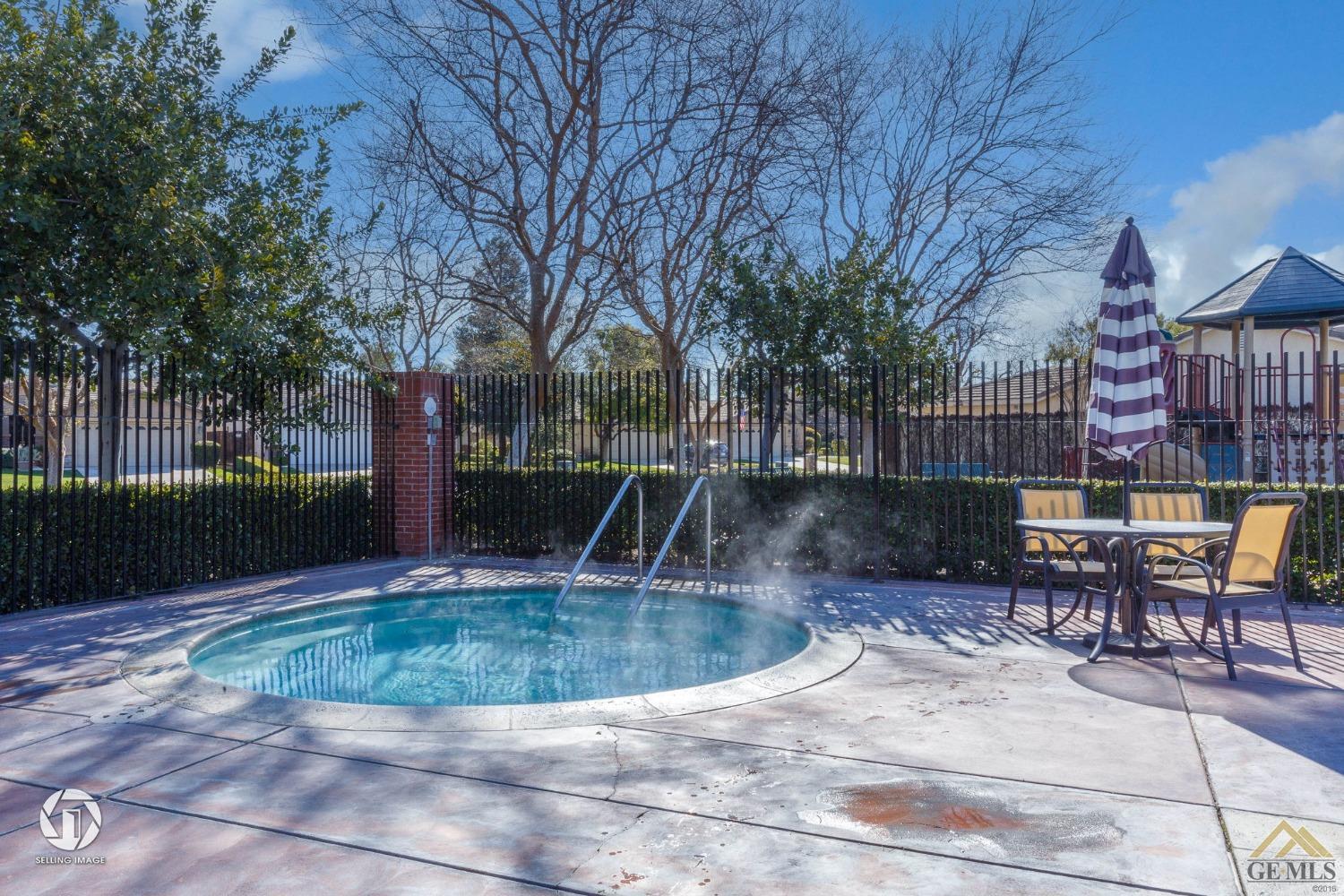 Undisclosed Address Bakersfield, CA 93311 - Photo 38 of 39 a view of a swimming pool with sitting area and furniture