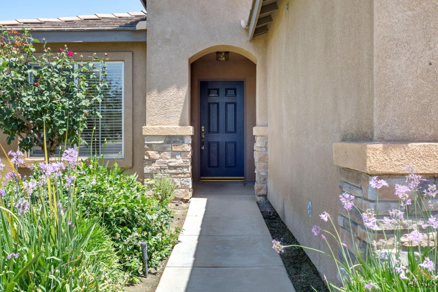 Undisclosed Address Bakersfield, CA 93311 - Photo 4 of 39 a view of a entryway door of the house
