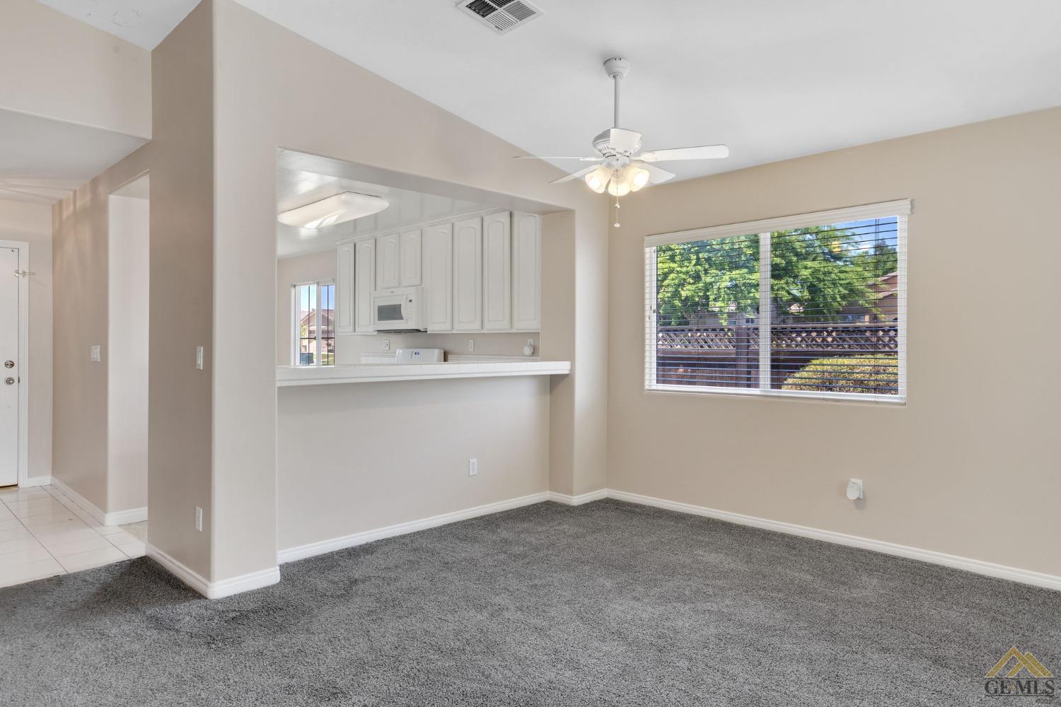 Undisclosed Address Bakersfield, CA 93311 - Photo 6 of 39 a view of kitchen with window and ceiling fan