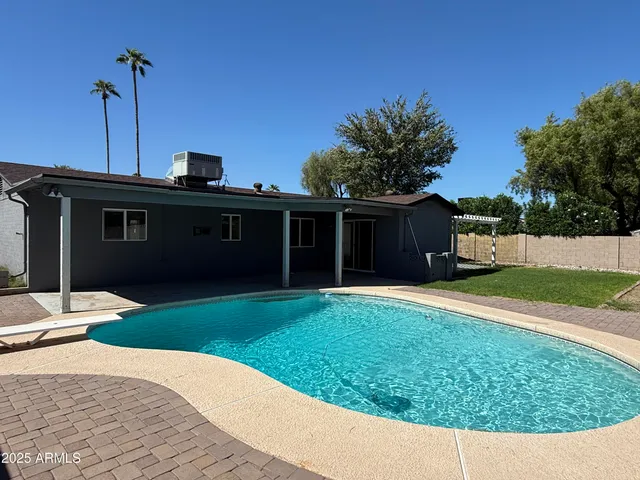a view of a house with a yard and garage