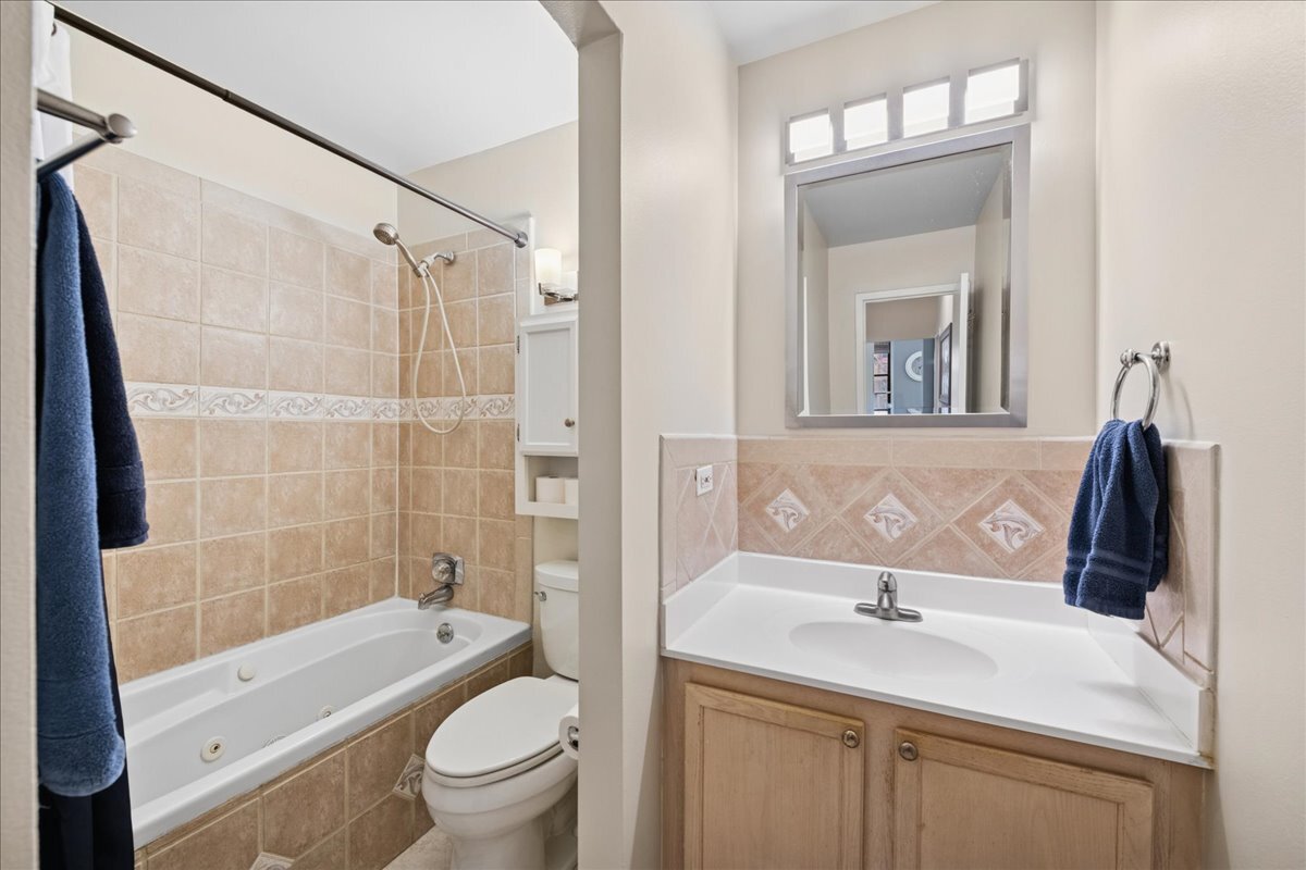 600 South Dearborn Street, Unit 601 Chicago, IL 60605 - Photo 16 of 18 a bathroom with a sink toilet tub and shower