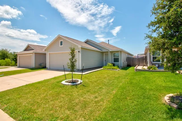 a house view with a garden space