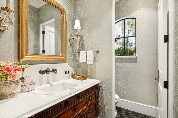 a bathroom with a sink and a mirror