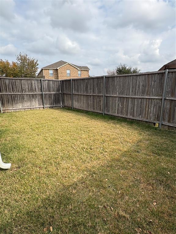 5900 Stone Mountain Road The Colony, TX 75056 - Photo 15 of 15 a view of a large garden with wooden fence
