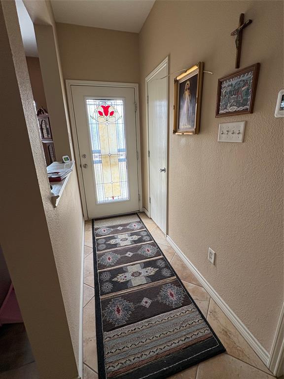 5900 Stone Mountain Road The Colony, TX 75056 - Photo 3 of 15 a view of an entryway with wooden floor