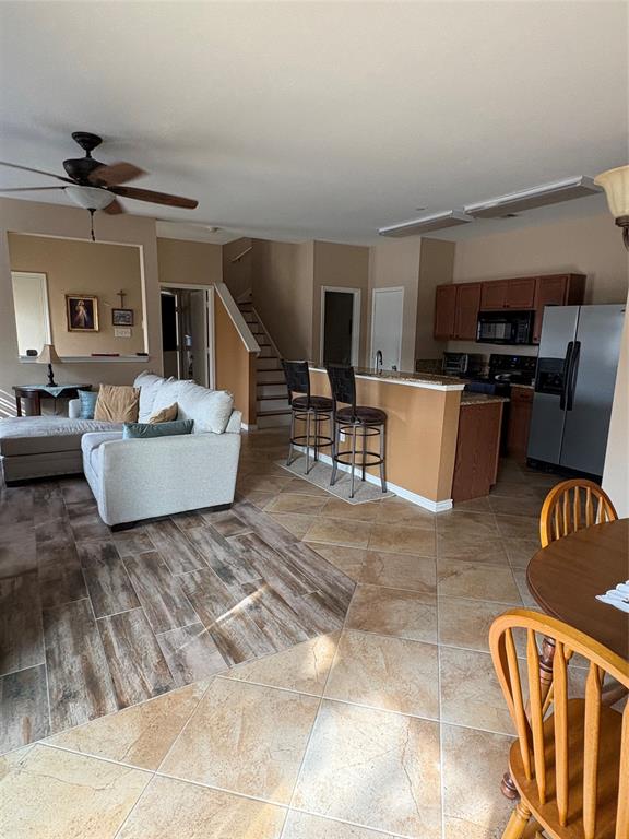 5900 Stone Mountain Road The Colony, TX 75056 - Photo 4 of 15 a living room with furniture and a wooden floor