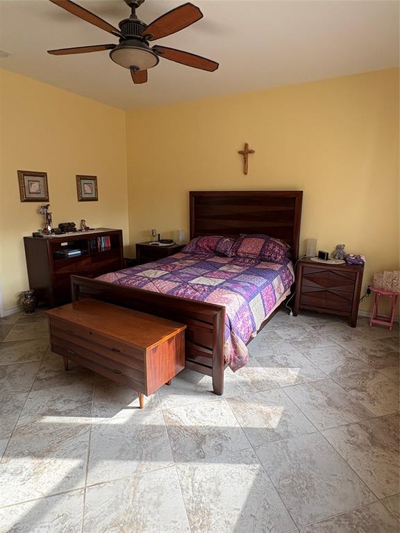 5900 Stone Mountain Road The Colony, TX 75056 - Photo 7 of 15 a bedroom with a bed and window