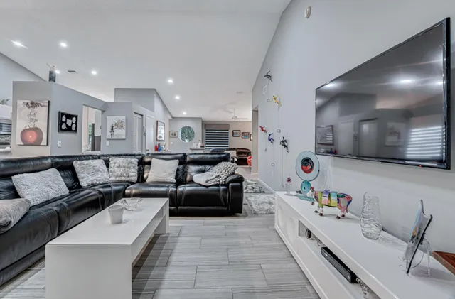 a kitchen with stainless steel appliances a refrigerator sink and cabinets