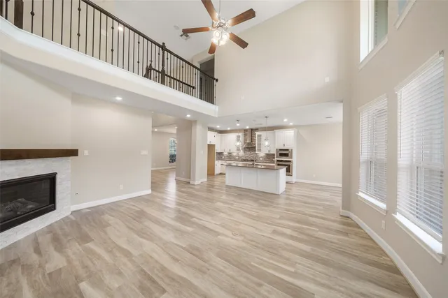 a view of kitchen with sink microwave and stove