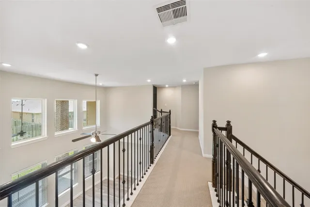 a view of a hallway with windows