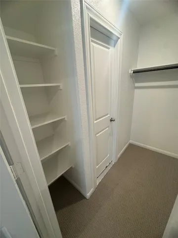 a view of an empty walk in closet