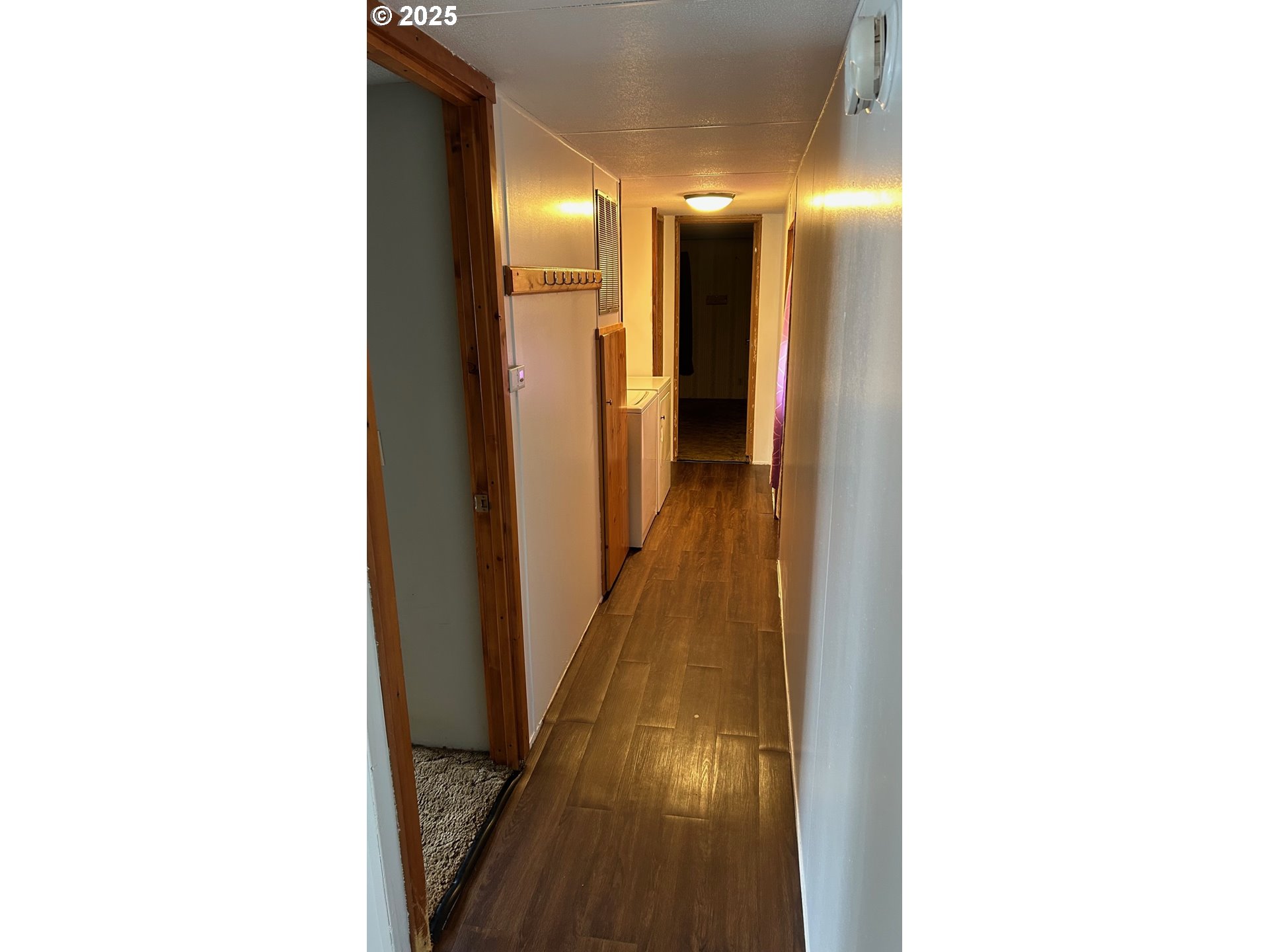 91323 Sandstone Lane, Unit 418 Coos Bay, OR 97420 - Photo 9 of 20 a view of hallway with stairs