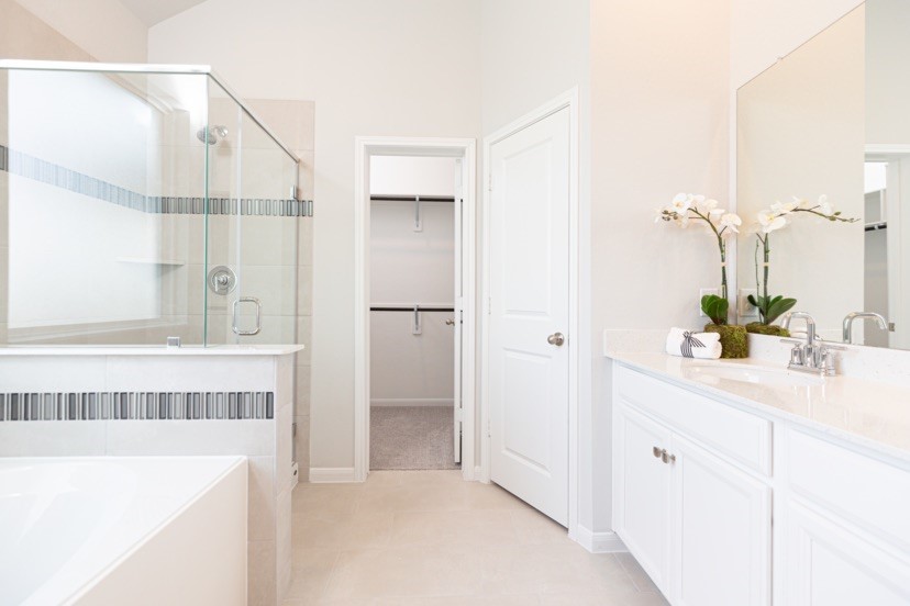 7455 Frst Strm Court Conroe, TX 77304 - Photo 6 of 7 a bathroom with a tub sink and mirror
