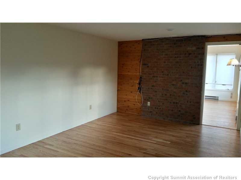 960 Mesa Drive Silverthorne, CO 80498 - Photo 3 of 25 a black and white photo of a living room