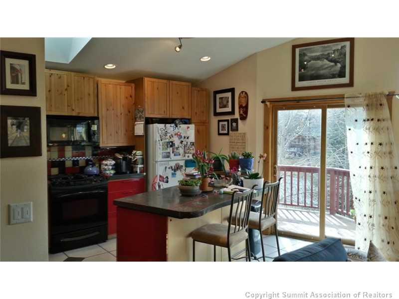 960 Mesa Drive Silverthorne, CO 80498 - Photo 21 of 25 a kitchen and a dining table with a kitchen view