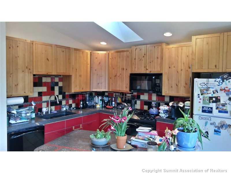 960 Mesa Drive Silverthorne, CO 80498 - Photo 22 of 25 a kitchen with lots of counter top space and a window