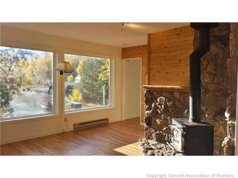 960 Mesa Drive Silverthorne, CO 80498 - Photo 4 of 25 a black and white photo of a living room