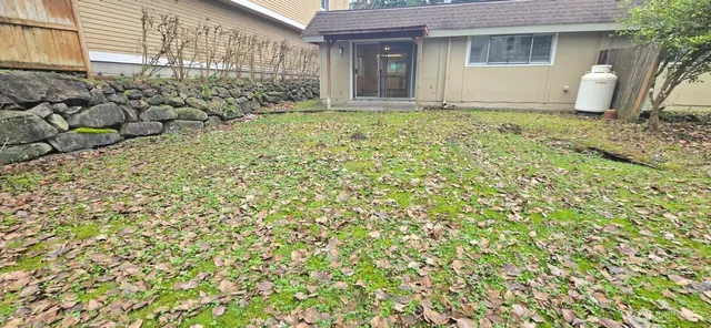 a view of a kitchen from a sink and a window