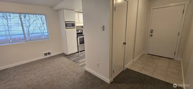 a view of a hallway with white walls