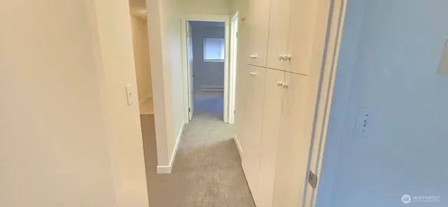 a kitchen with metallic refrigerator and sink