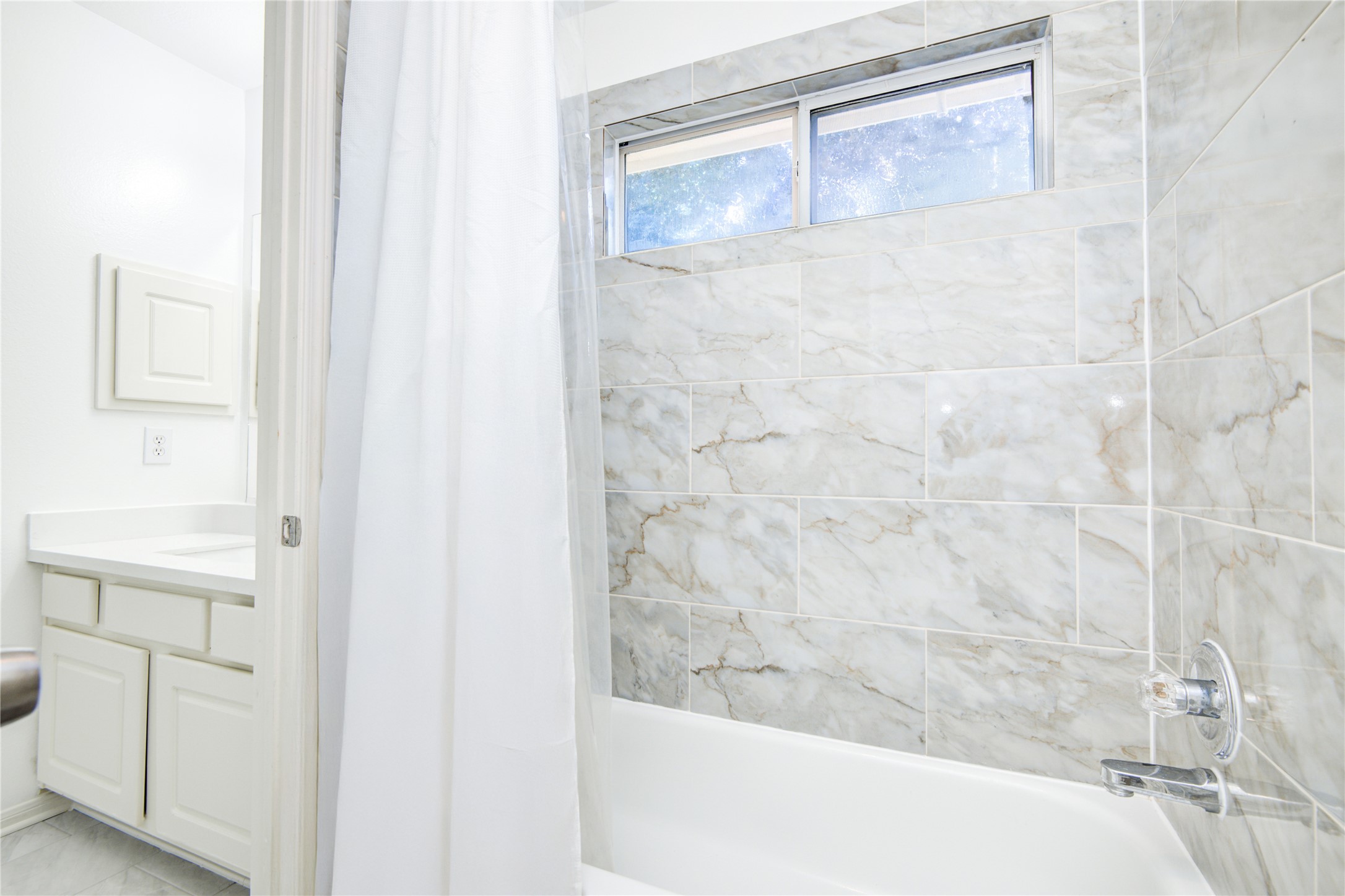 14411 Chartley Falls Drive Houston, TX 77044 - Photo 14 of 36 a bathroom with a bathtub and shower