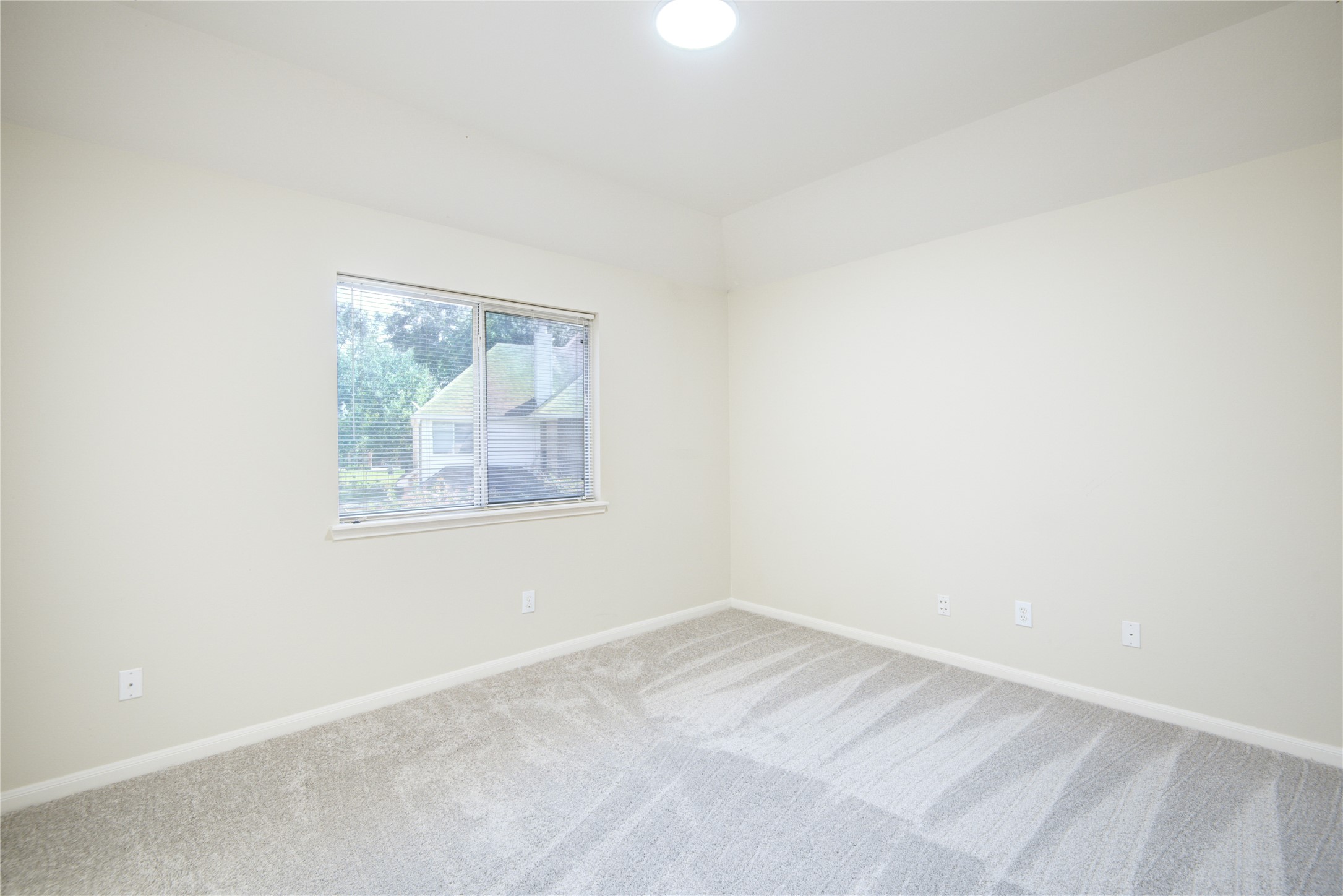14411 Chartley Falls Drive Houston, TX 77044 - Photo 18 of 36 an empty room with a window