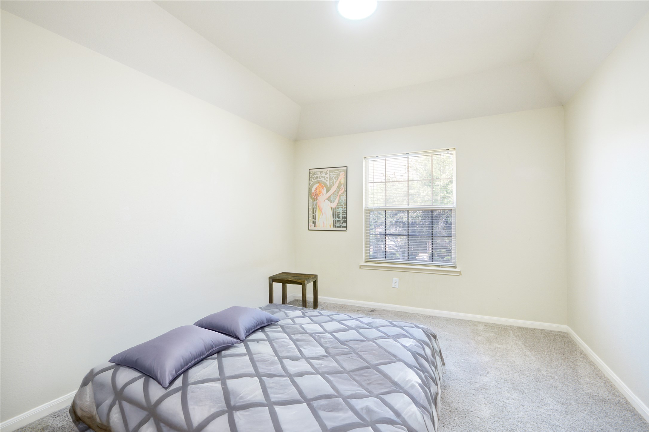 14411 Chartley Falls Drive Houston, TX 77044 - Photo 20 of 36 a bedroom with a bed and a window