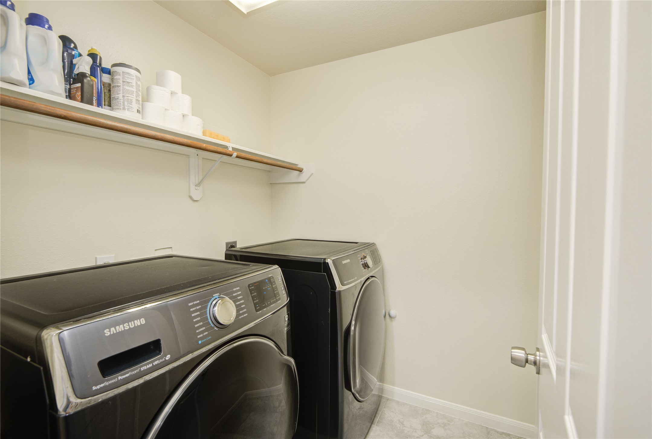 14411 Chartley Falls Drive Houston, TX 77044 - Photo 23 of 36 a utility room with dryer and washer