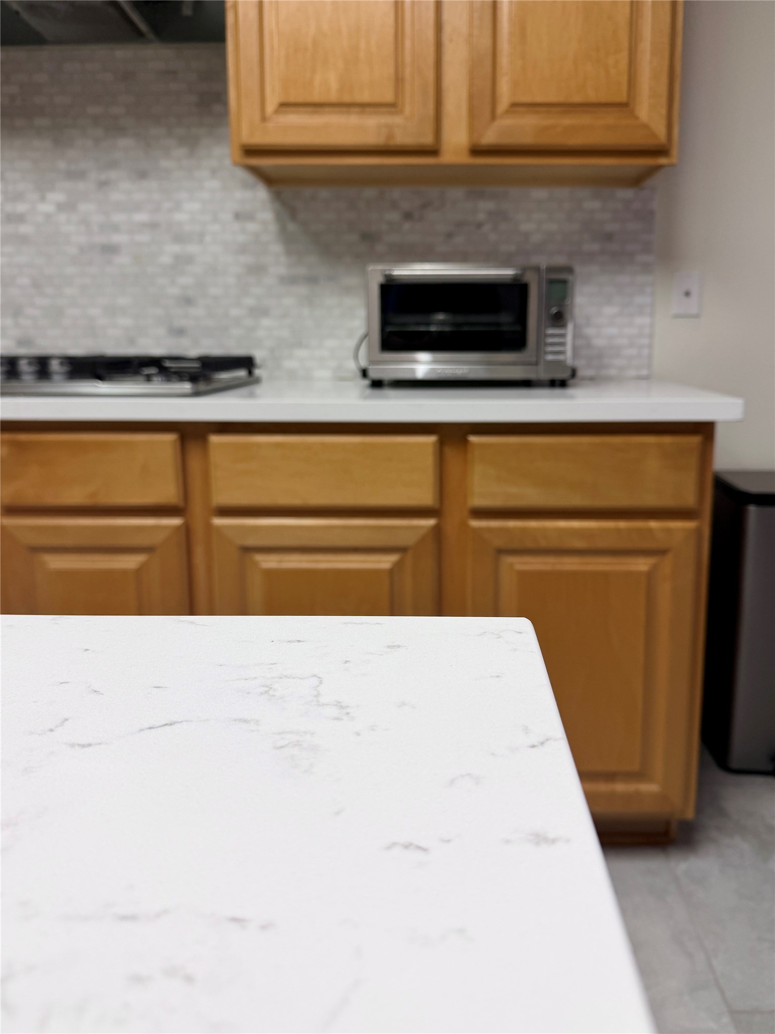 14411 Chartley Falls Drive Houston, TX 77044 - Photo 28 of 36 a kitchen with granite countertop cabinets appliances and a counter space
