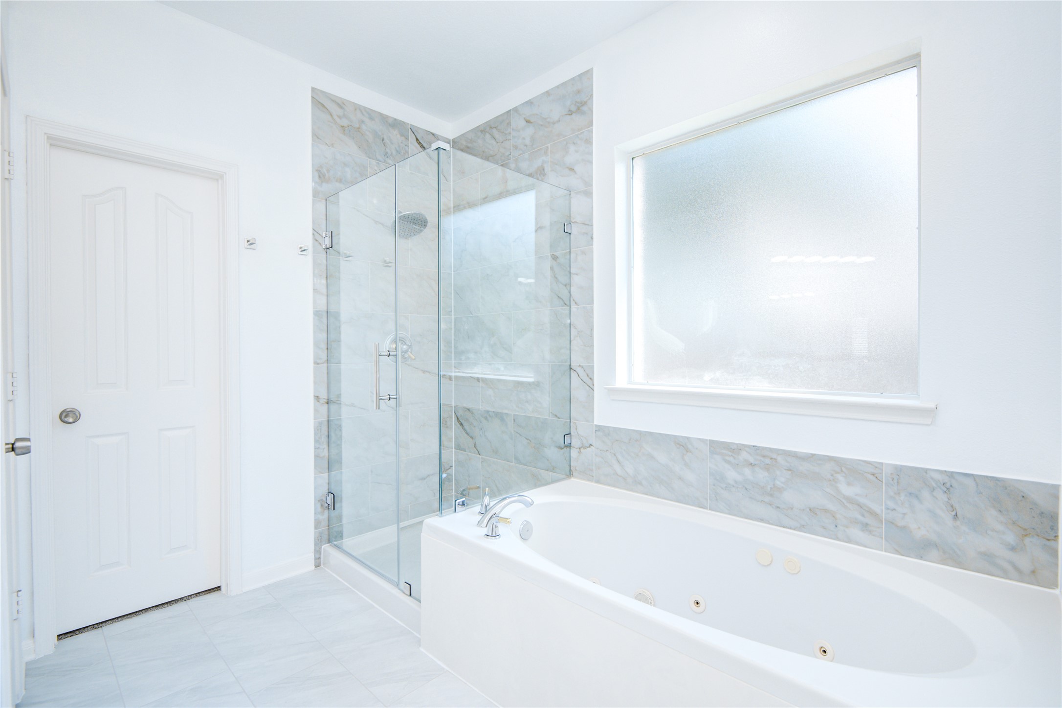 14411 Chartley Falls Drive Houston, TX 77044 - Photo 31 of 36 a white bath tub sitting next to a shower