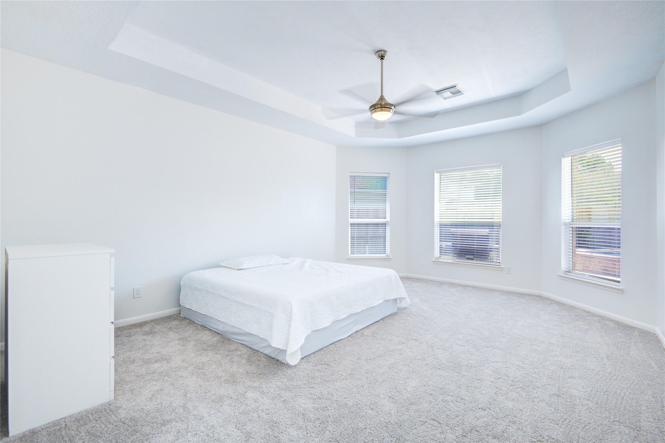 14411 Chartley Falls Drive Houston, TX 77044 - Photo 33 of 36 a spacious bedroom with a bed and a large window