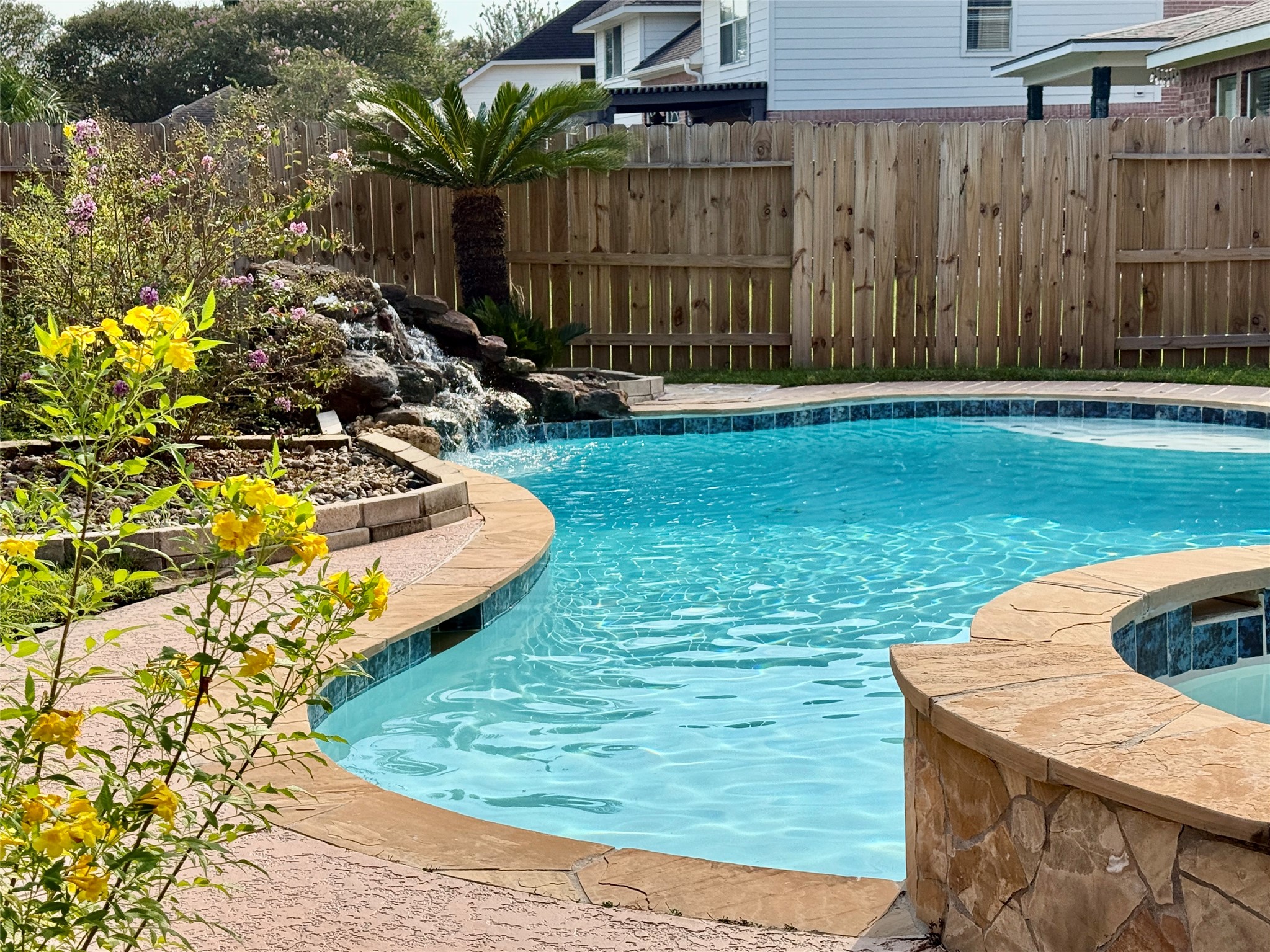 14411 Chartley Falls Drive Houston, TX 77044 - Photo 6 of 36 a view of a backyard with swimming pool