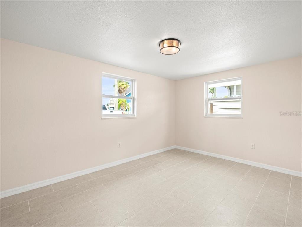 3408 Crape Myrtle Drive Hernando Beach, FL 34607 - Photo 24 of 46 an empty room with windows